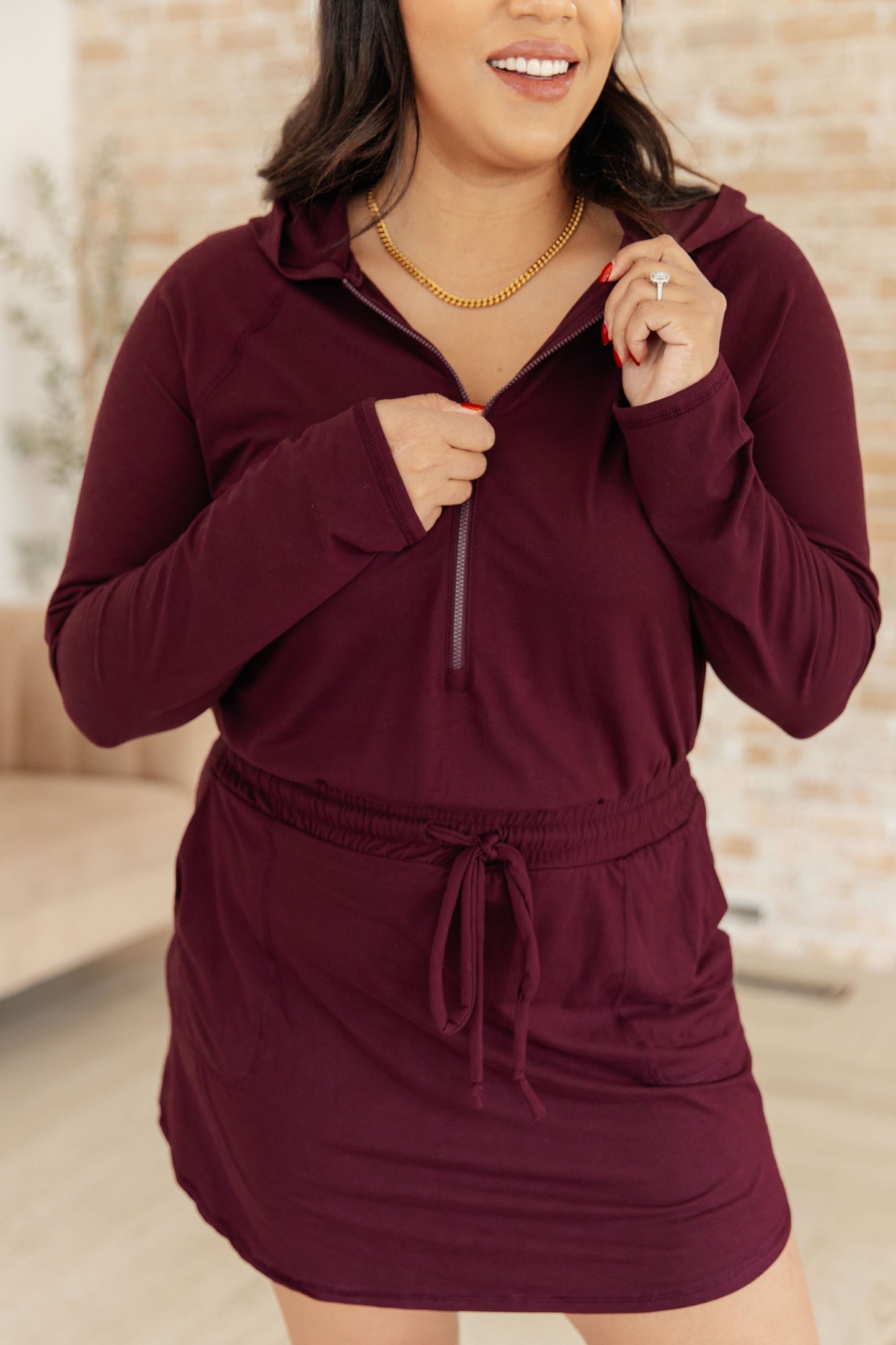 Getting Out Long Sleeve Hoodie Romper in Wine